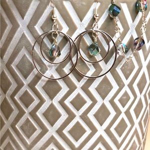 Hand wrapped bracelet with matching earrings. Iridescent gems in silver wire